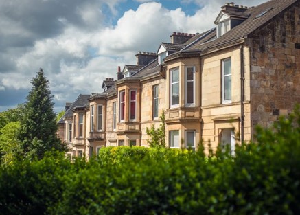 Row of smart Victorian houses in the sunshine, housing market looking sunny and robust